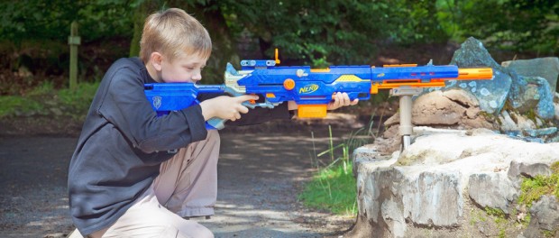 boy using Nerf sniper rifle