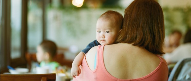 mother with infant on shoulder